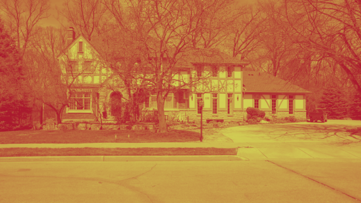 McMaster building with leafless tress in duotone in yellow and red