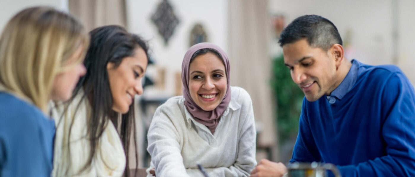 Microcredential Banner image of people gathered around a table